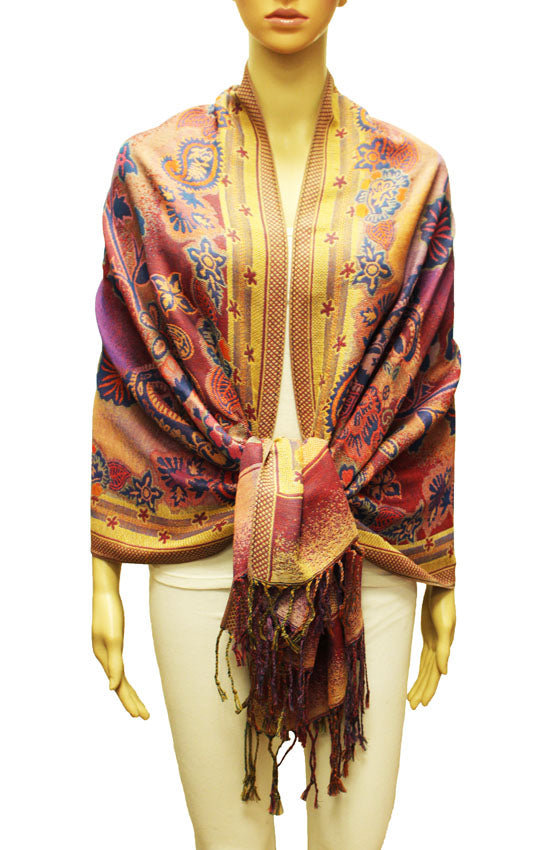 This image features a luxurious, multicolor pashmina shawl draped elegantly over a mannequin. The shawl boasts a rich tapestry of colors, including blues, greens, and golds, with a subtle shimmer that suggests a metallic thread or finish.