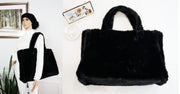 A black faux fur handbag displayed in two images, one with a mannequin showing the bag as a handbag and the other showing it as a shoulder bag.